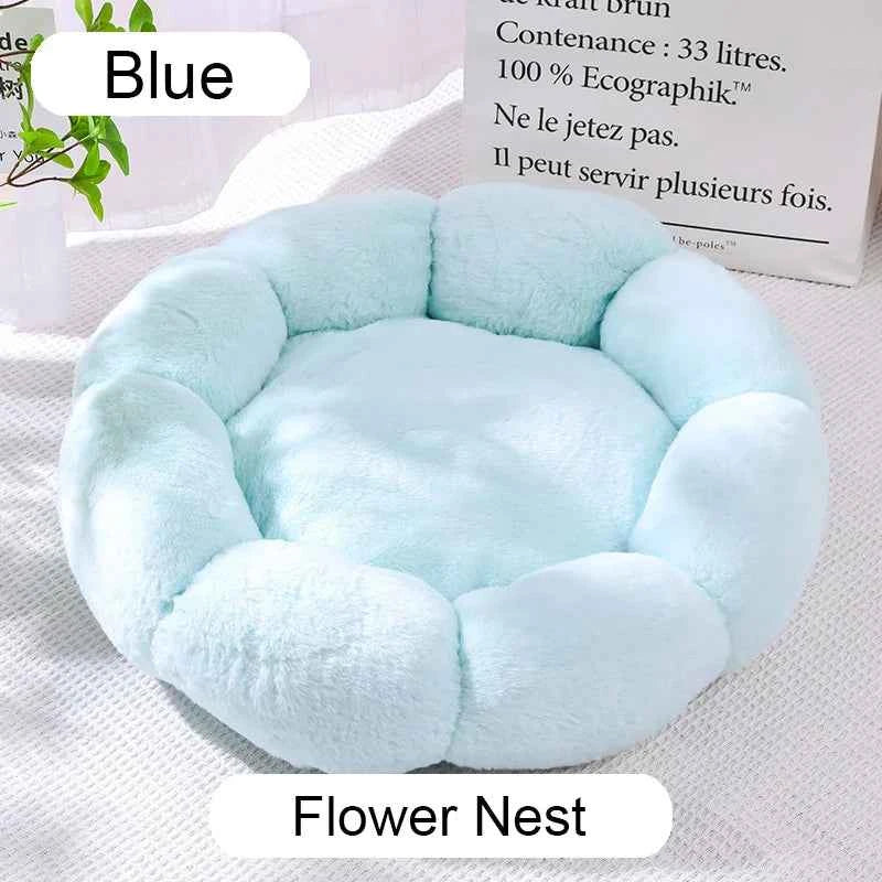 Blue round plush pet bed with cushioned center and raised donut-style edges
