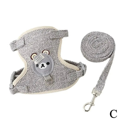 Gray speckled pet harness vest with bear patch and adjustable leash, coiled rope