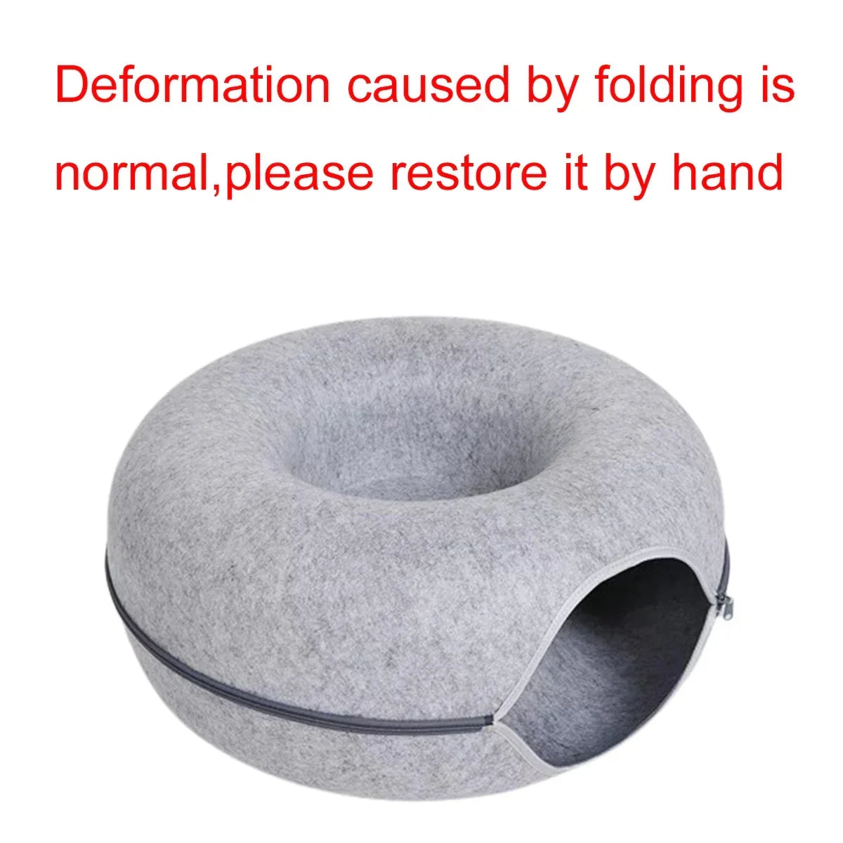 Gray felt donut cat bed with cozy cave entrance, ideal for napping pets