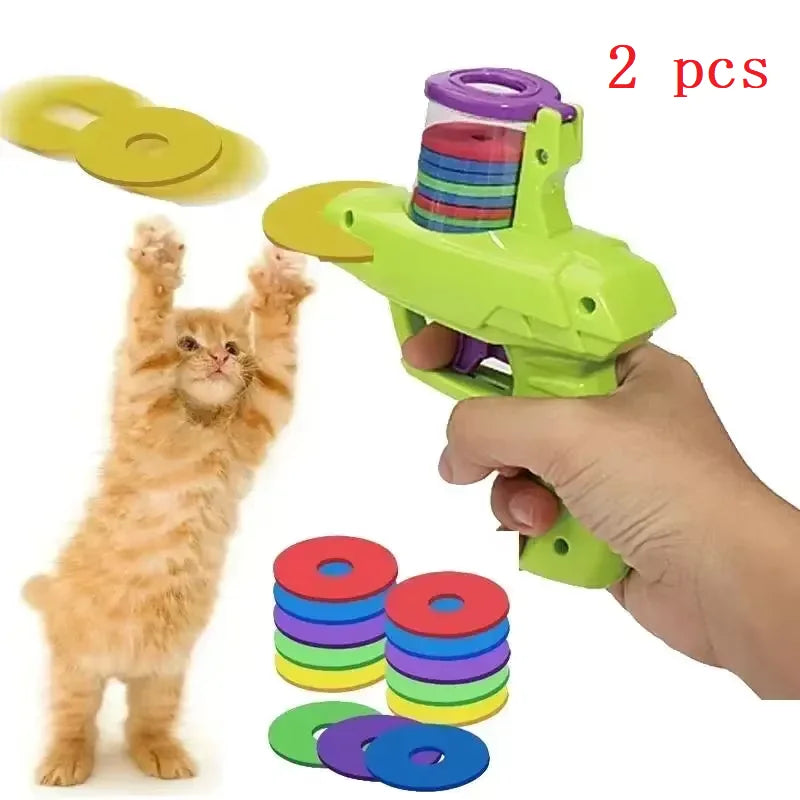 Green and purple cat disc launcher toy with stacked colorful soft discs set