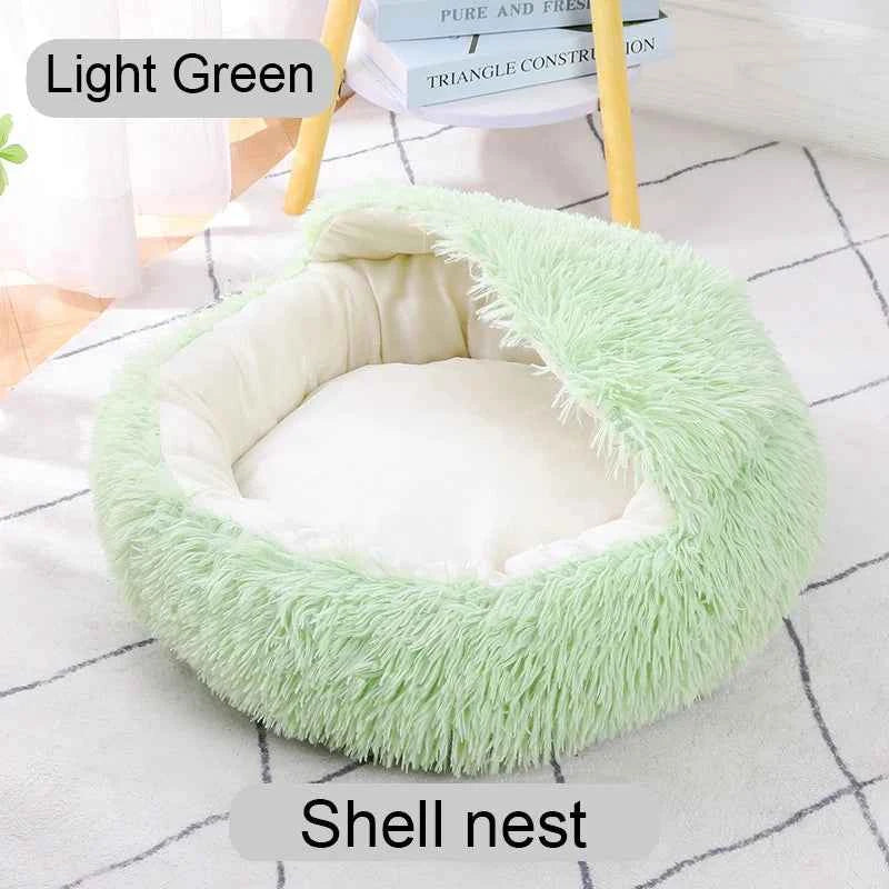 Light green shaggy round pet bed with soft inner cushion and raised donut-style rim