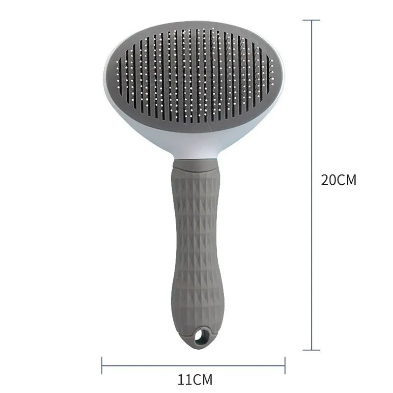 Gray pet hair removal brush with round needle pad and textured ergonomic handle