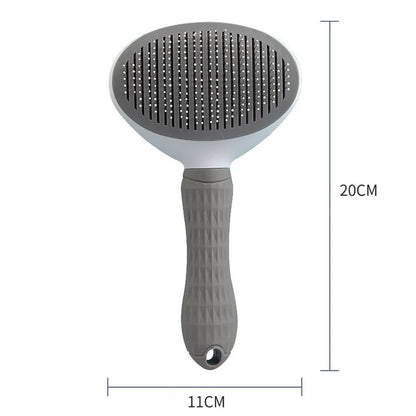 Gray pet hair removal brush with round needle pad and textured ergonomic handle