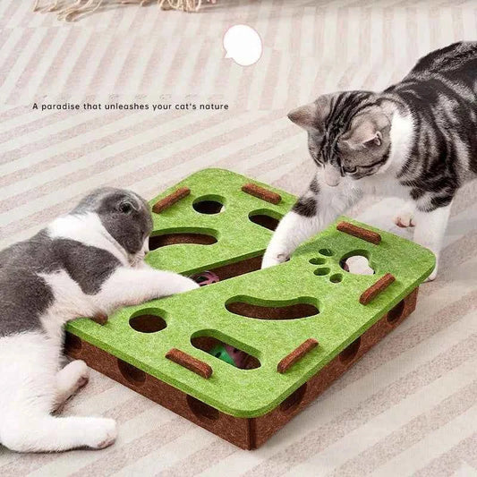 Interactive cat puzzle scratch toy with green felt top and brown base, with holes and pegs