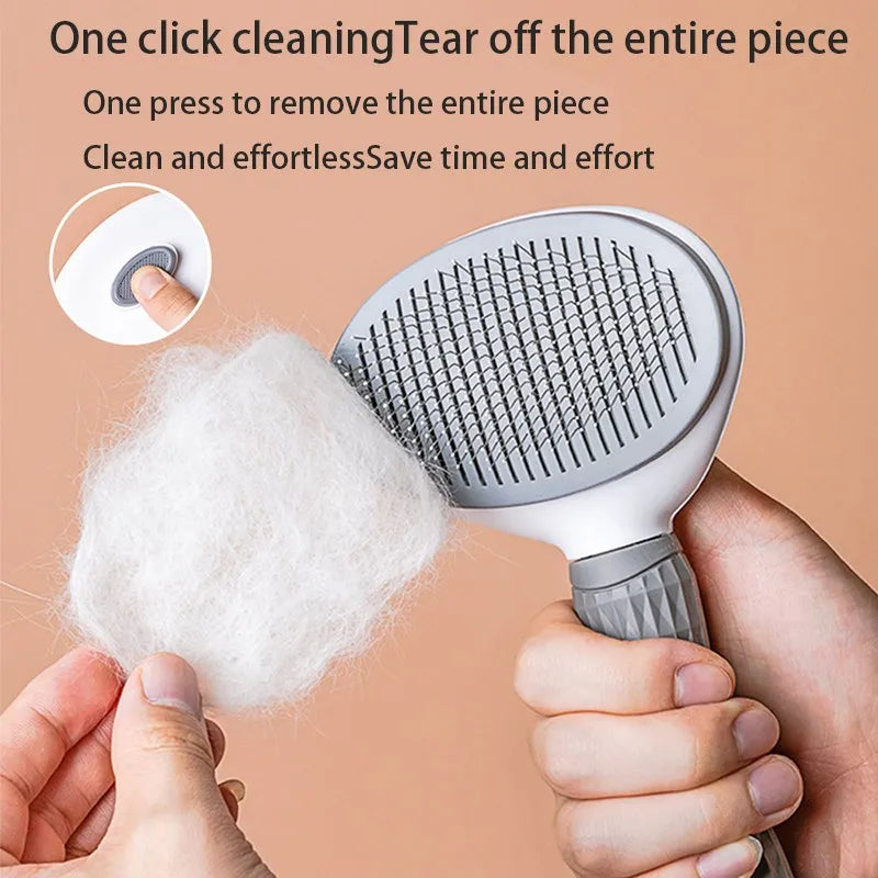 Gray pet hair removal brush with rounded needle head held in hand