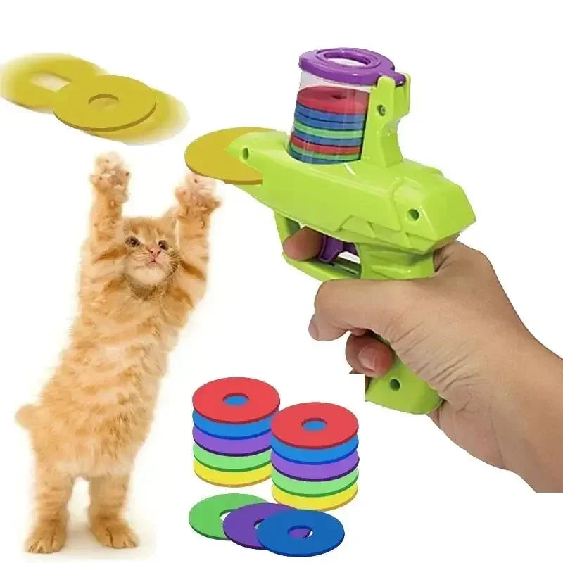 Green cat disc launcher toy with purple top and stacked colorful soft discs