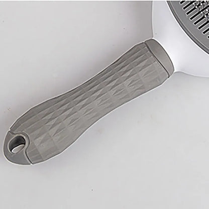 Gray grooming brush handle with textured grip and hanging loop