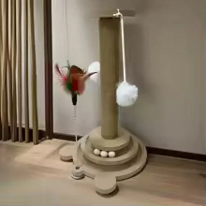 Gray sisal cat scratching post with dangling pom-pom balls and round tiered platform