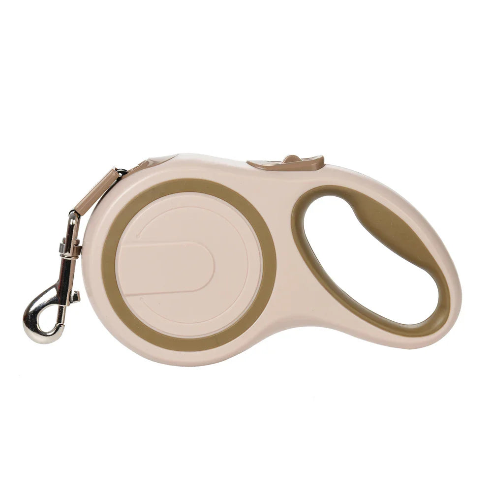 Tan retractable dog leash with round casing and metal clip