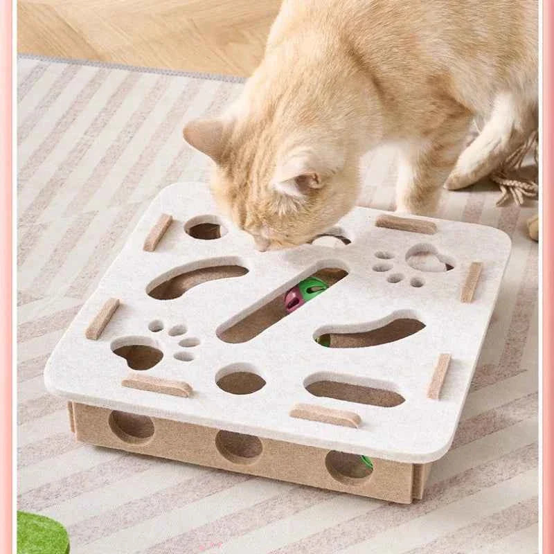 Interactive cat puzzle scratch toy with white felt top and circular cutouts for toys