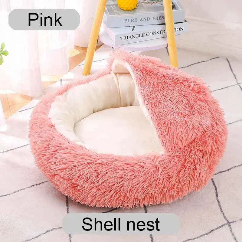 Pink shaggy round pet bed with soft inner cushion and raised donut-style rim