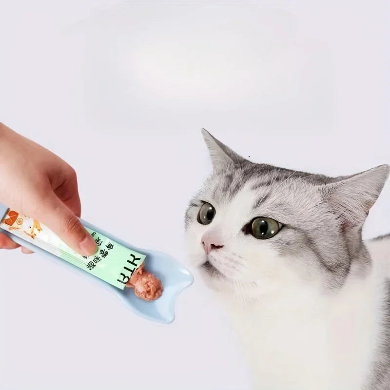 Blue cat lick treat spoon dispensing wet treat