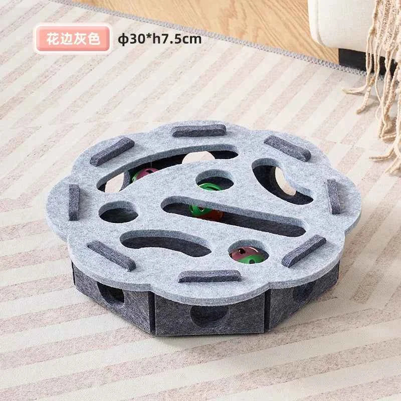 Gray cat puzzle toy with circular maze top and four green-and-red peekaboo holes
