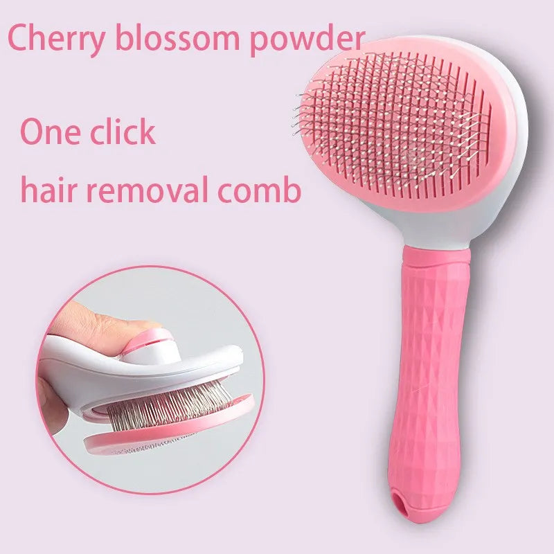 Pink pet grooming brush with round needle pad and textured grip handle