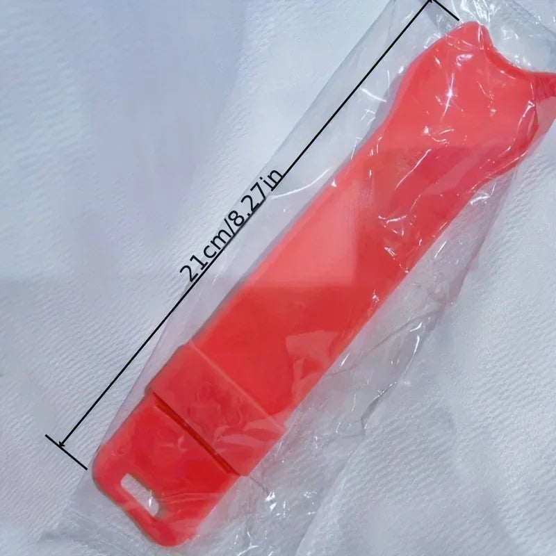 Pink squeeze cat treat spoon with size label on packaging