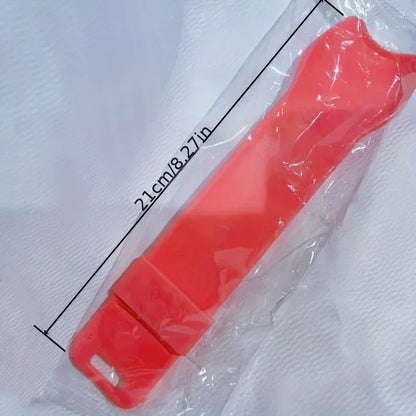 Pink squeeze cat treat spoon with size label on packaging