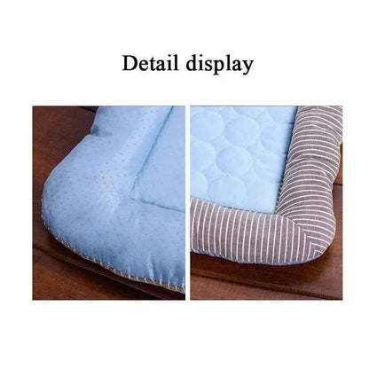 Close-up of cooling pet mat fabric: light blue dotted pad and striped bolster edge.