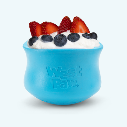 Blue silicone dog treat toy bowl filled with fruit and yogurt