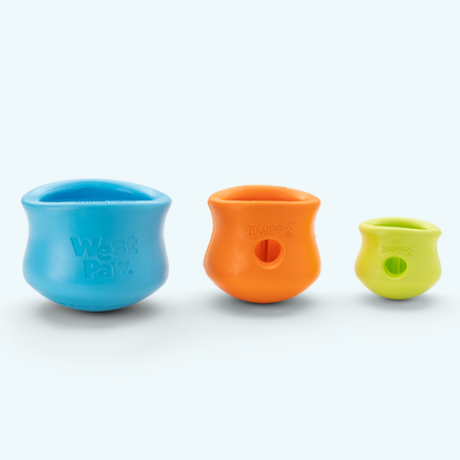 Set of silicone dog treat toy bowls in blue, orange, and lime green