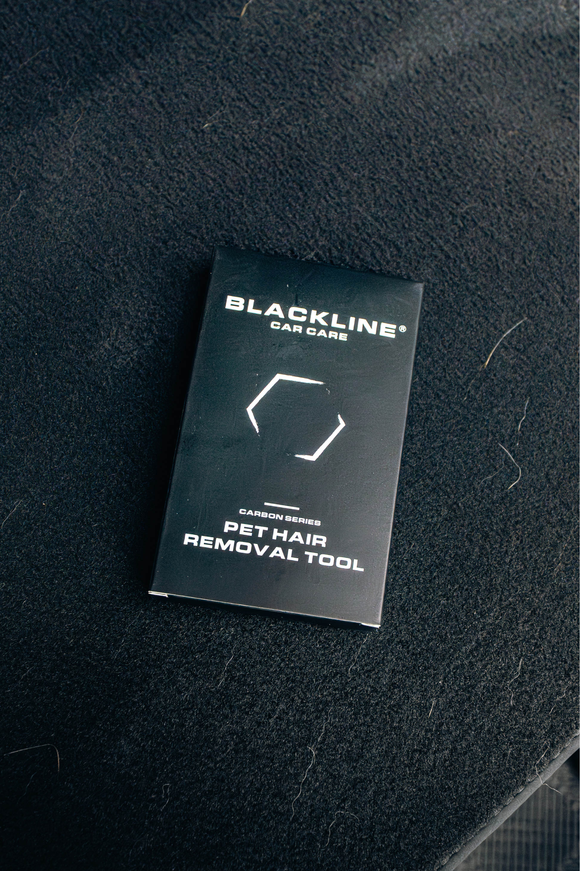 BlackLine pet hair removal tool box on grooming surface