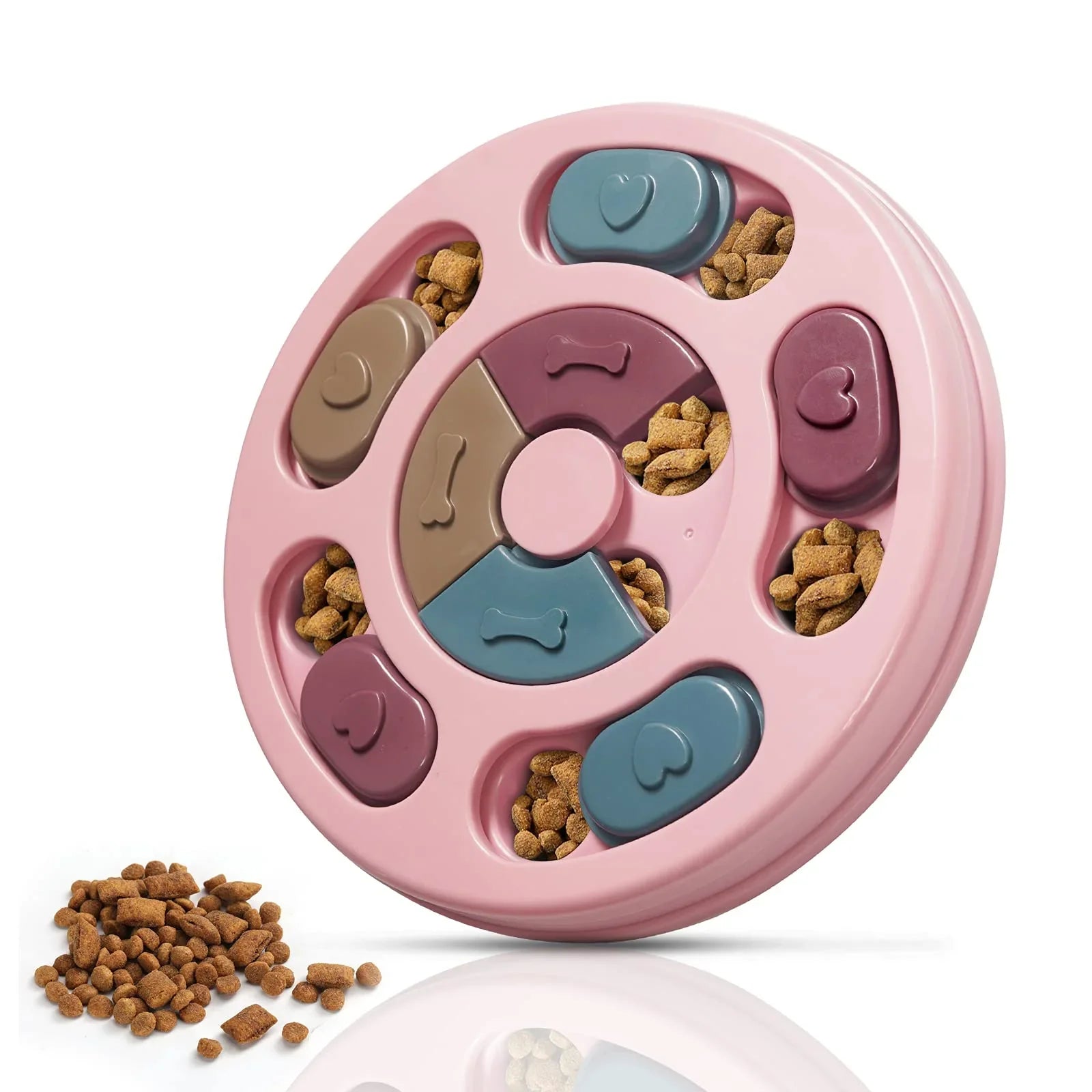Pink dog treat puzzle feeder with rotating sections and bone shapes; treats shown nearby.
