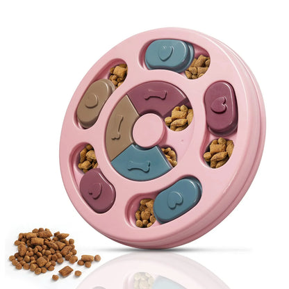 Pink dog treat puzzle feeder with rotating sections and bone shapes; treats shown nearby.