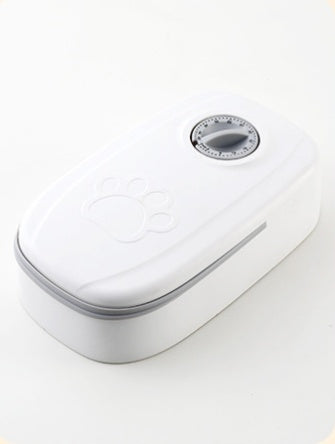 Pet feeder lid with white housing and one circular dial control