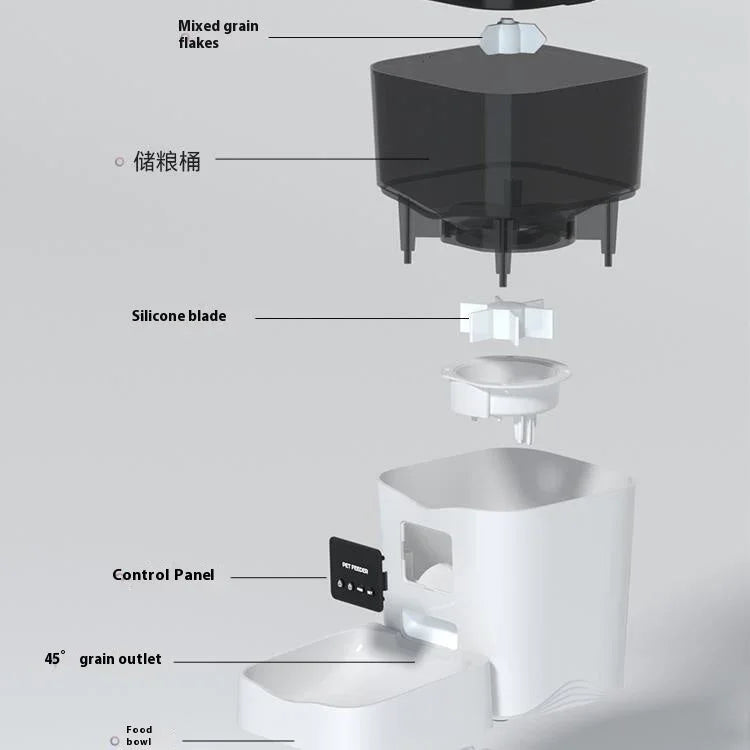 Automatic cat feeder interior with top hopper, silicone blade, and white feeding bowl