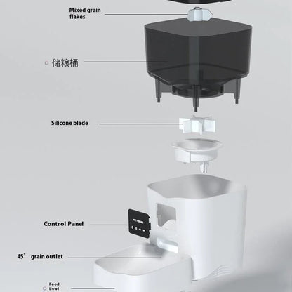 Automatic cat feeder interior with top hopper, silicone blade, and white feeding bowl