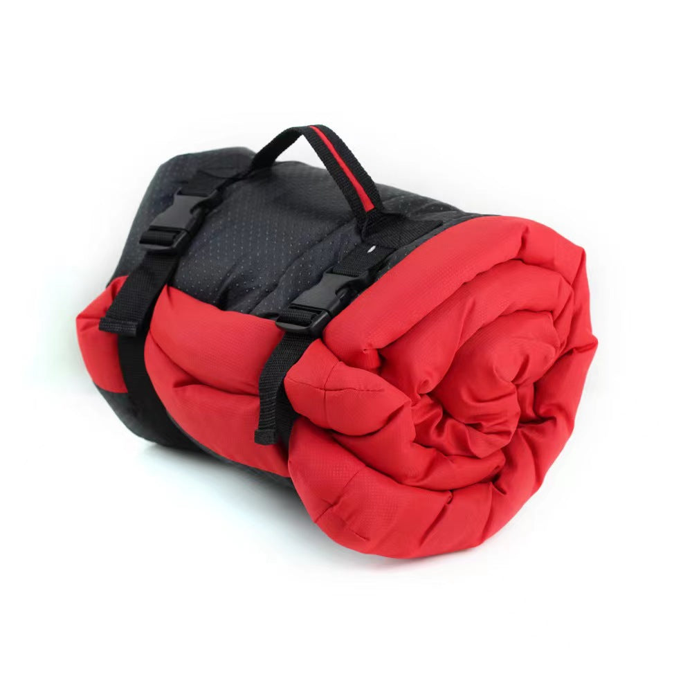 Foldable waterproof dog bed mat, red and black with carrying straps, rolled bundle