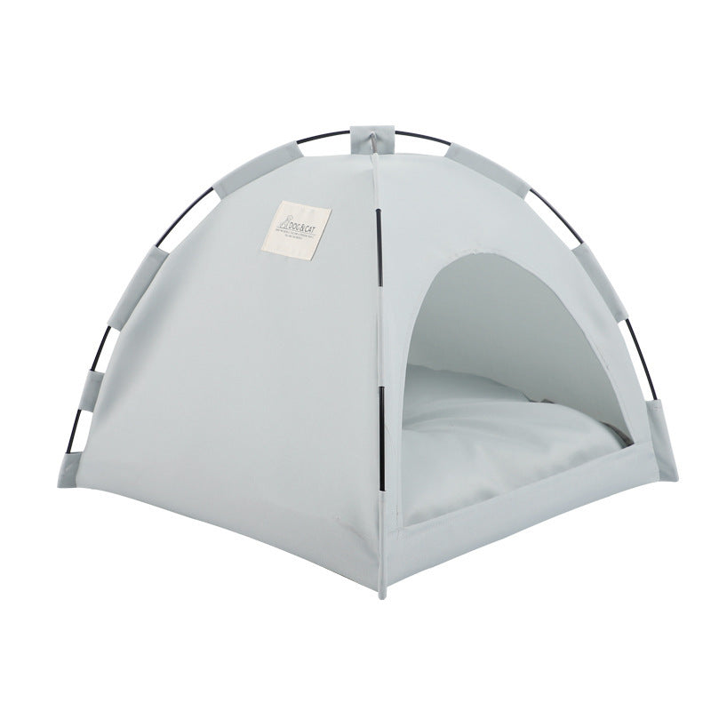 Light gray pet tent bed with arched frame and white padded interior