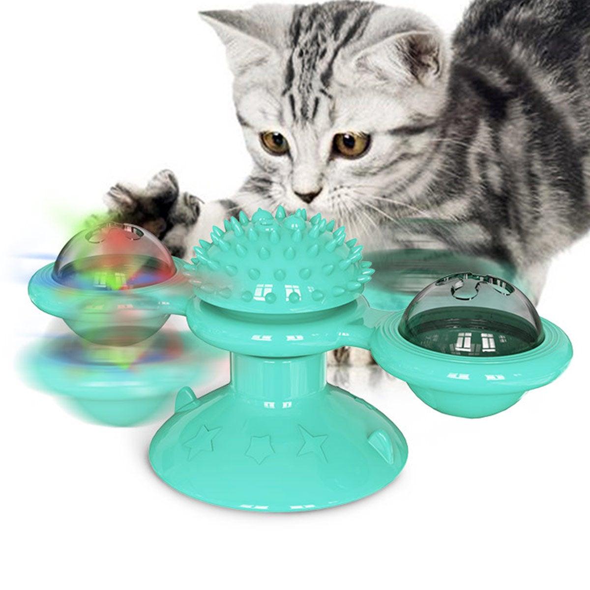 Cat windmill toy with teal spiky massage pad and two domed rotating side cups
