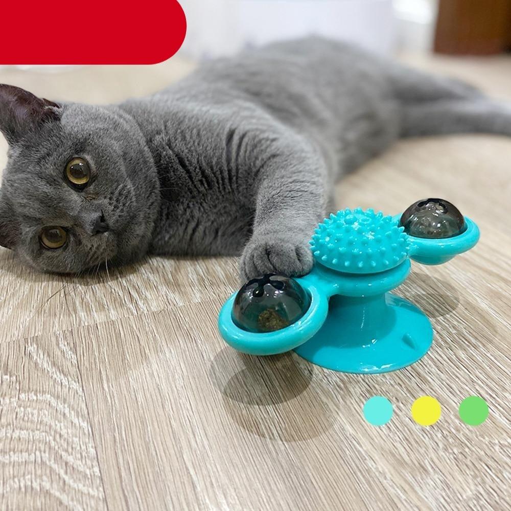 Cat massage windmill toy with teal spiky pad and rotating domed cups for cats