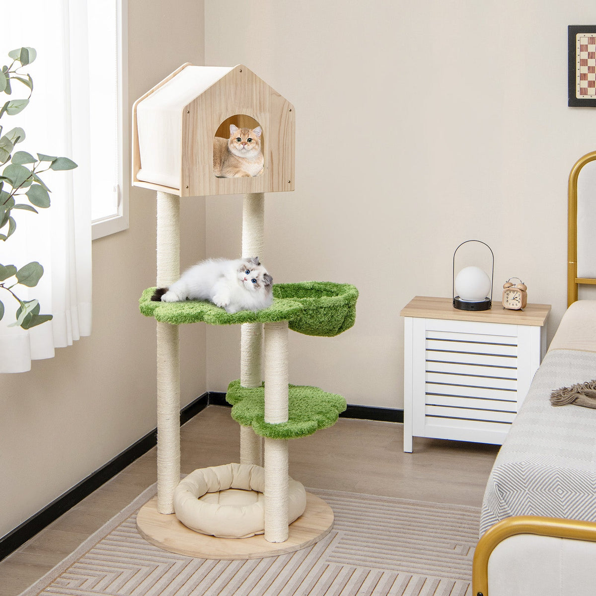 55-inch tall cat climbing stand with green scratching posts, perches, and round plush cat bed