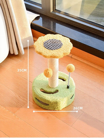 Cat scratching post with dangling balls, green base and yellow flower top on pole.