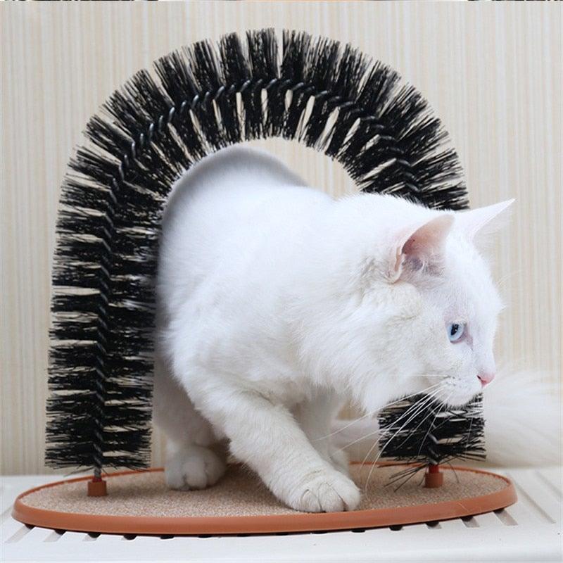 Cat arch massager with black bristle arch and round beige base, shown with white cat