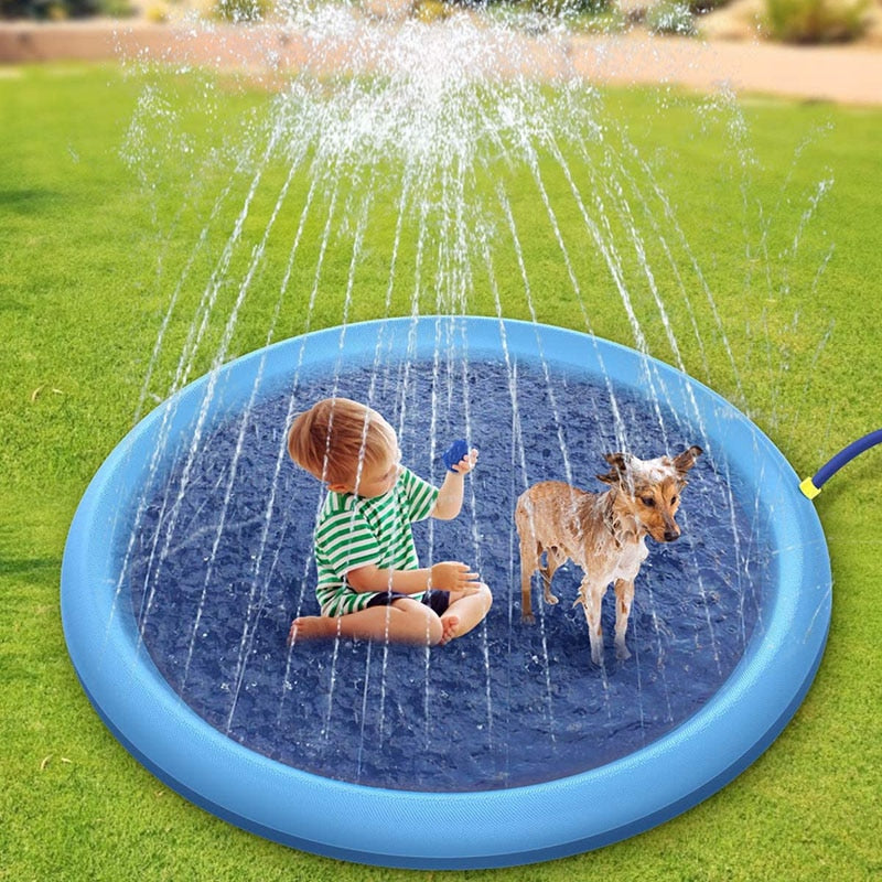 Round blue pet sprinkler pad releasing water spray for dogs in a yard
