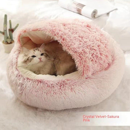 Cozy winter plush pet bed, round pink cave bed with plush rim and padded inner base.