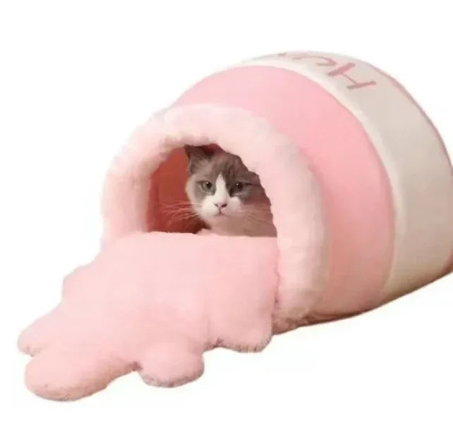 Cozy pink cat tunnel bed with plush paw entrance, perfect for cozy naps and playful hideaways.