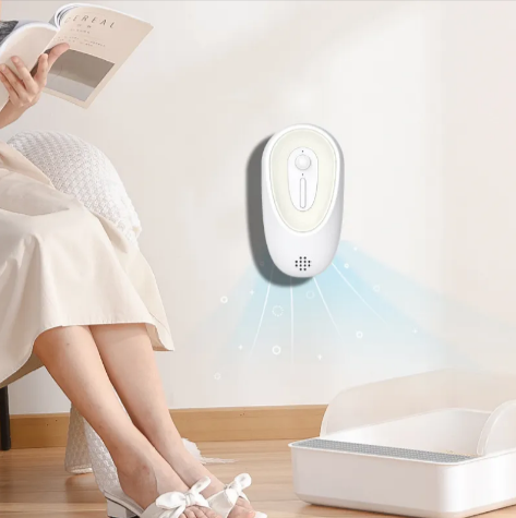 Pet odor eliminator unit, white oval wall device with button and vent grille