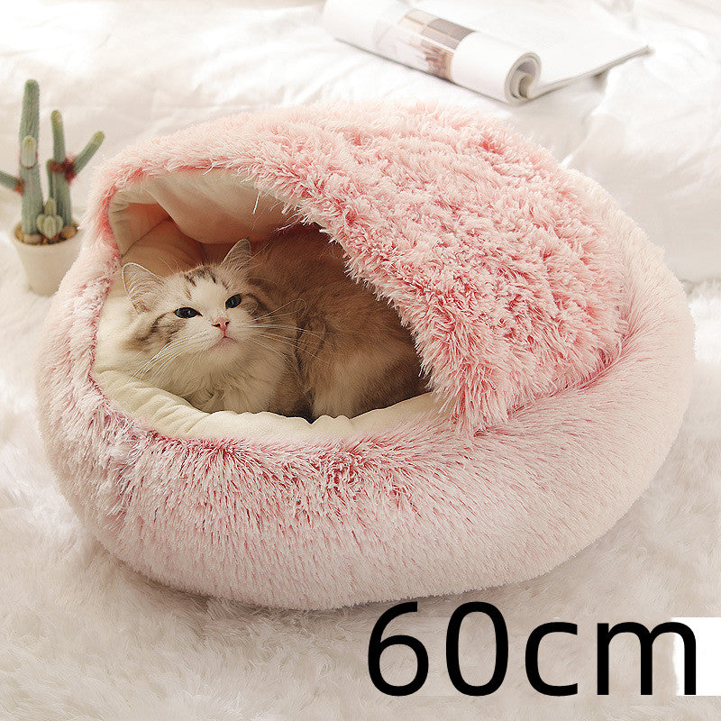 Pink cozy plush pet bed with cat curled inside, soft shag texture