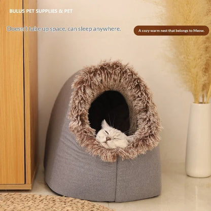 A white cat sleeping inside a cozy grey Pet Zen enclosed winter cat bed with faux fur trim.