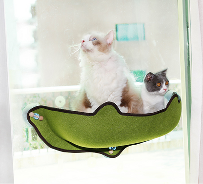 Green window cat hammock with dark trim and four suction cups