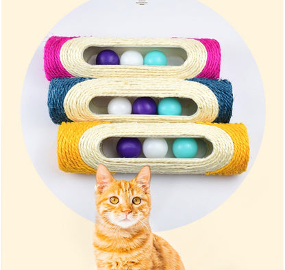 Three stacked sisal drum cat toys in pink, blue, and yellow with rolling ball compartments