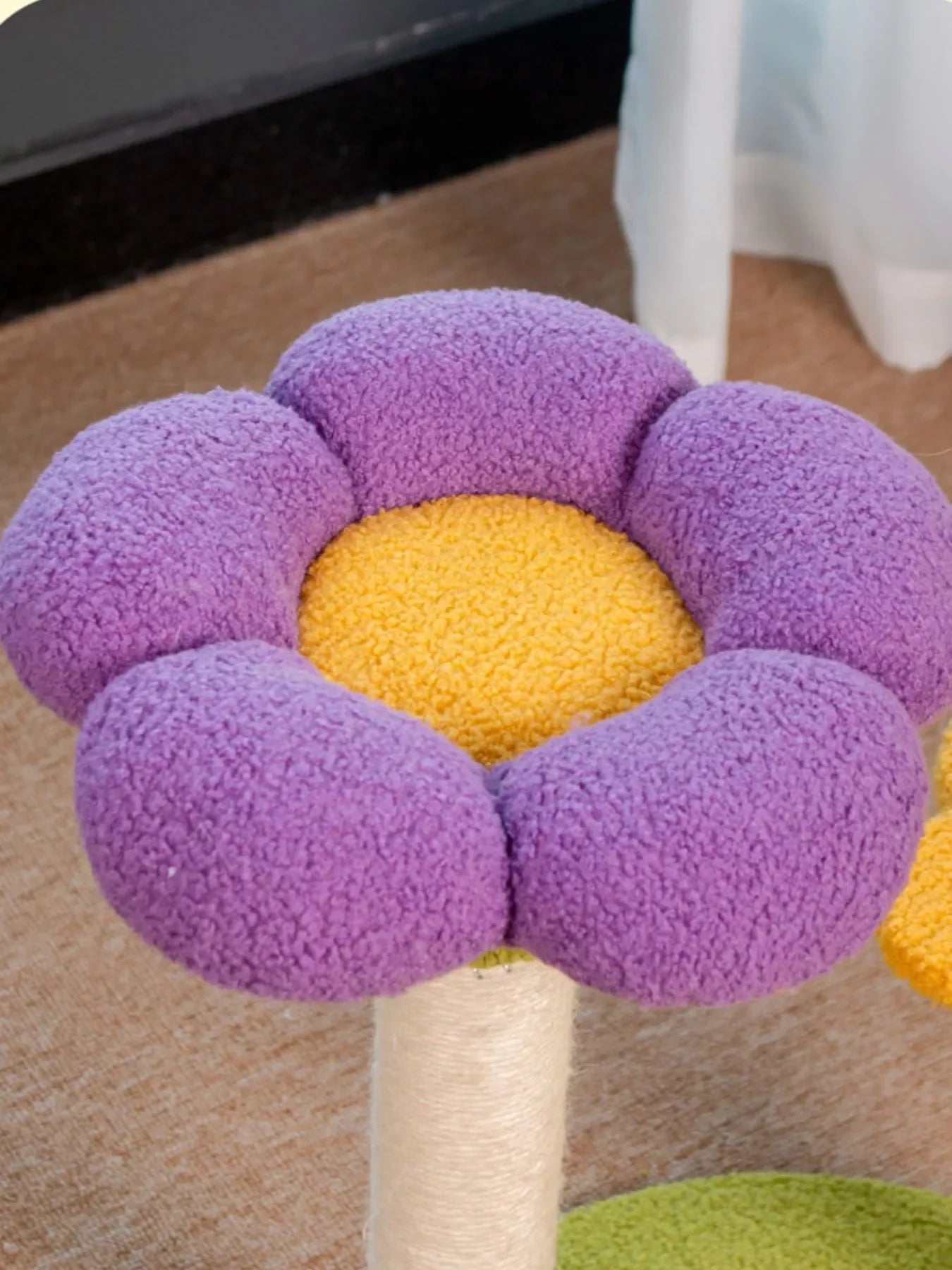 Purple flower-shaped plush cat tree perch with textured beige pole