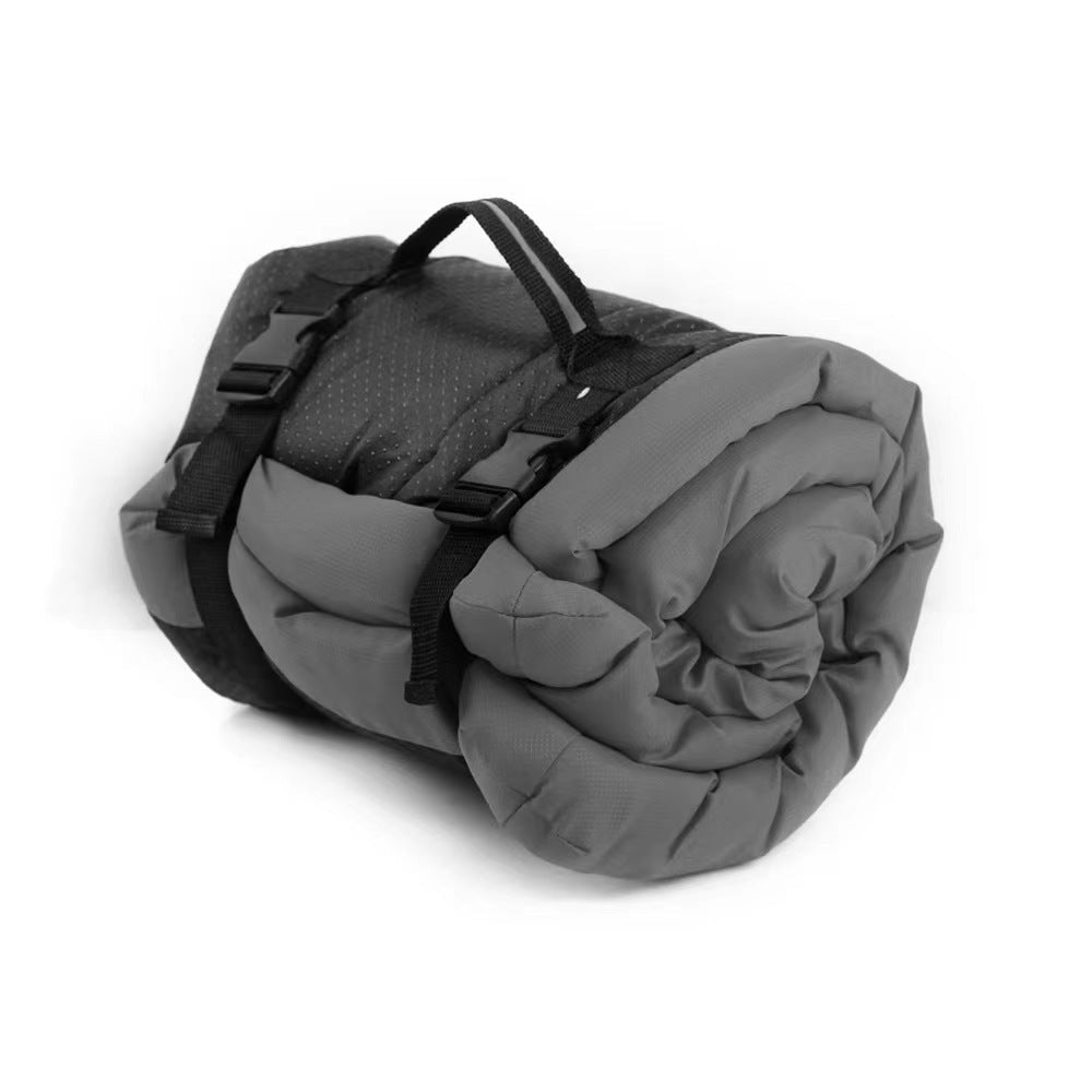 Foldable waterproof dog bed mat, gray and black with carrying straps, rolled bundle
