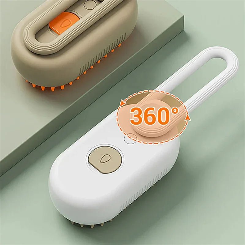 Cat steam brush with 360° head, white body and orange bristles, power button