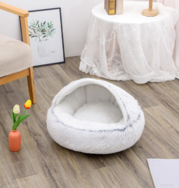 Cozy winter plush pet bed, light gray round cave with white plush inner cushion.