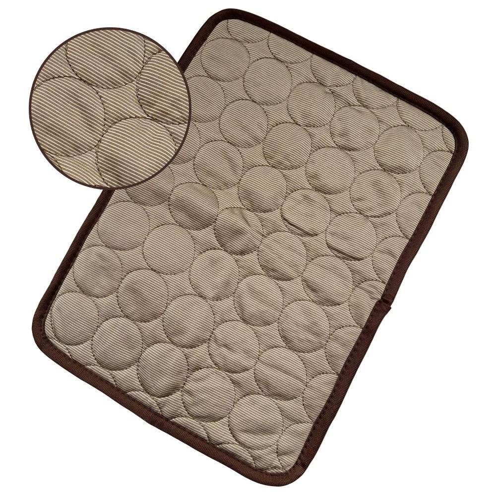 Beige pet cooling pad with raised circular bubble texture and dark brown trim