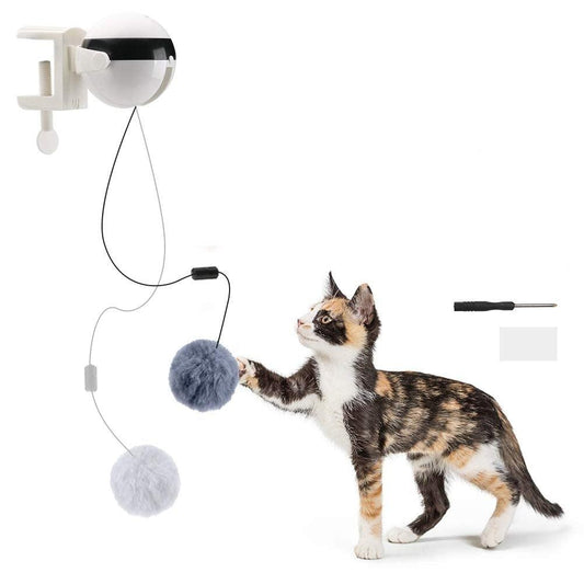 Automatic cat teaser with black-and-white dome and two gray plush balls, with cat